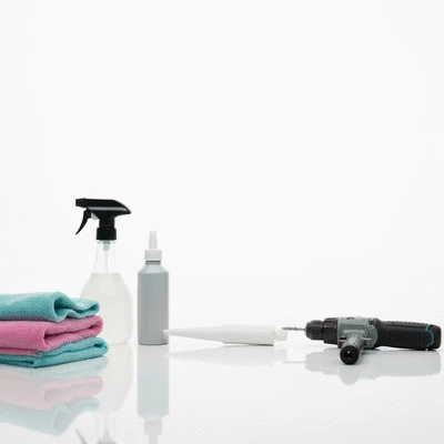 Various cleaning and repair tools for aluminum windows laid out on a clean surface